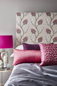 bed cushions and a floral headboard
