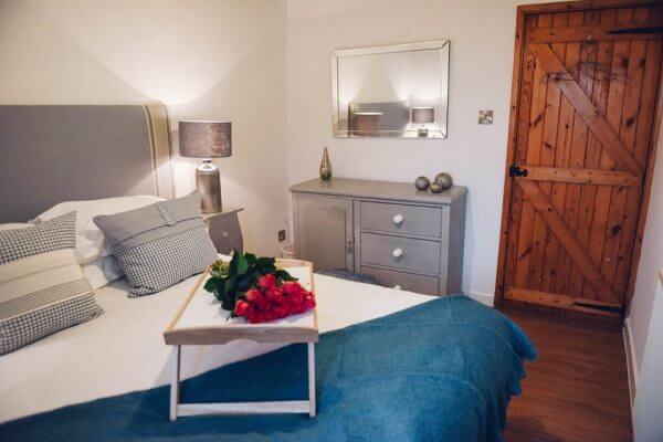 A bed with a breakfast tray on it
