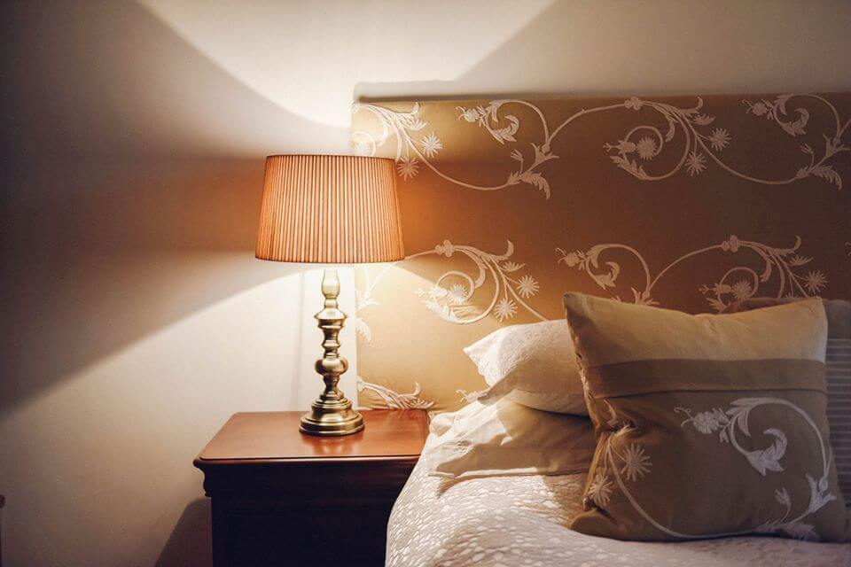 A bed and bedside table